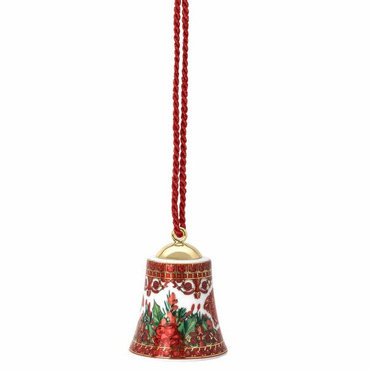 Decorative bell ornament with a red string on a white background