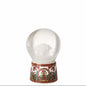 Decorative snow globe with a red and gold base on a white background