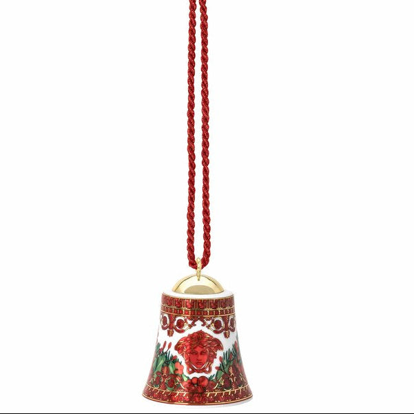 Decorative bell with red floral design on a white background