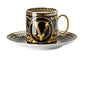 Decorative black and gold cup with saucer on a white background