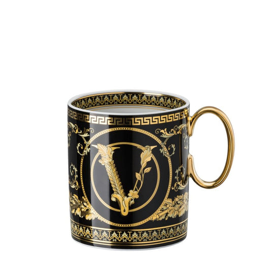 Decorative mug with gold and black design on a white background