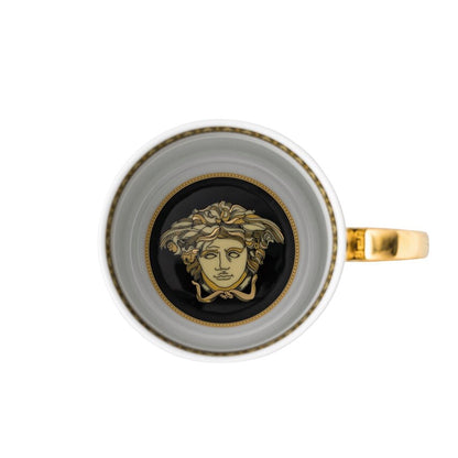 Decorative cup with a face design on a white background