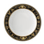 Decorative plate with black and gold rim on a white background