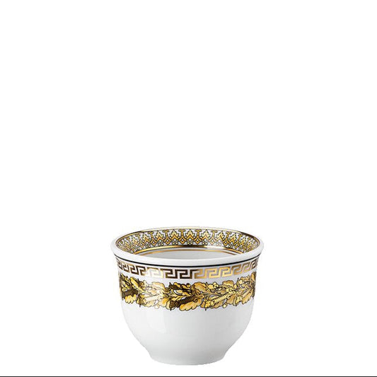 Decorative white cup with gold and green pattern on a white background
